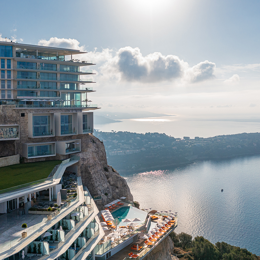 The exterior of Maybourne Riviera with a view on the coastline